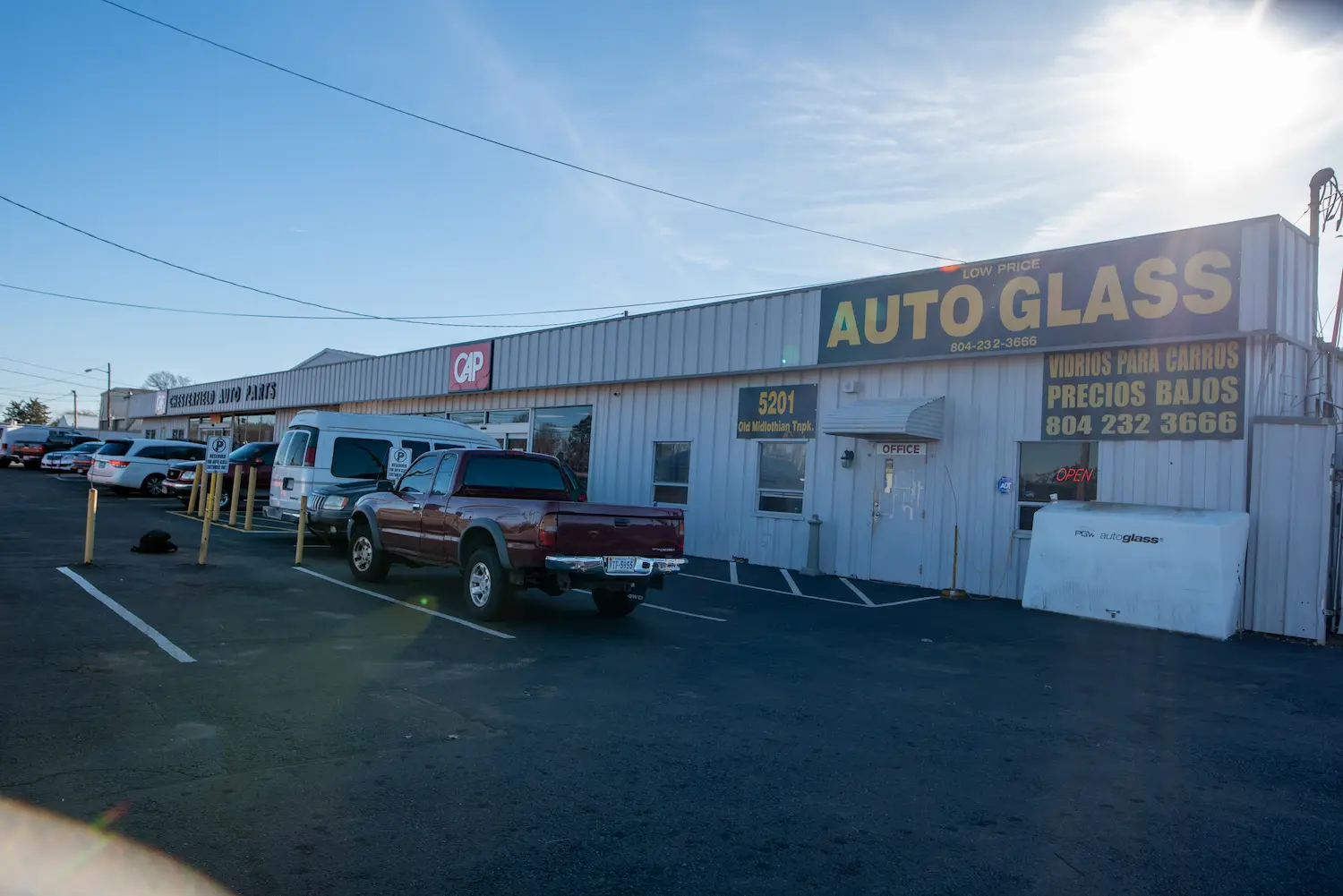 Corner of building showing Low Price Auto Glass sign