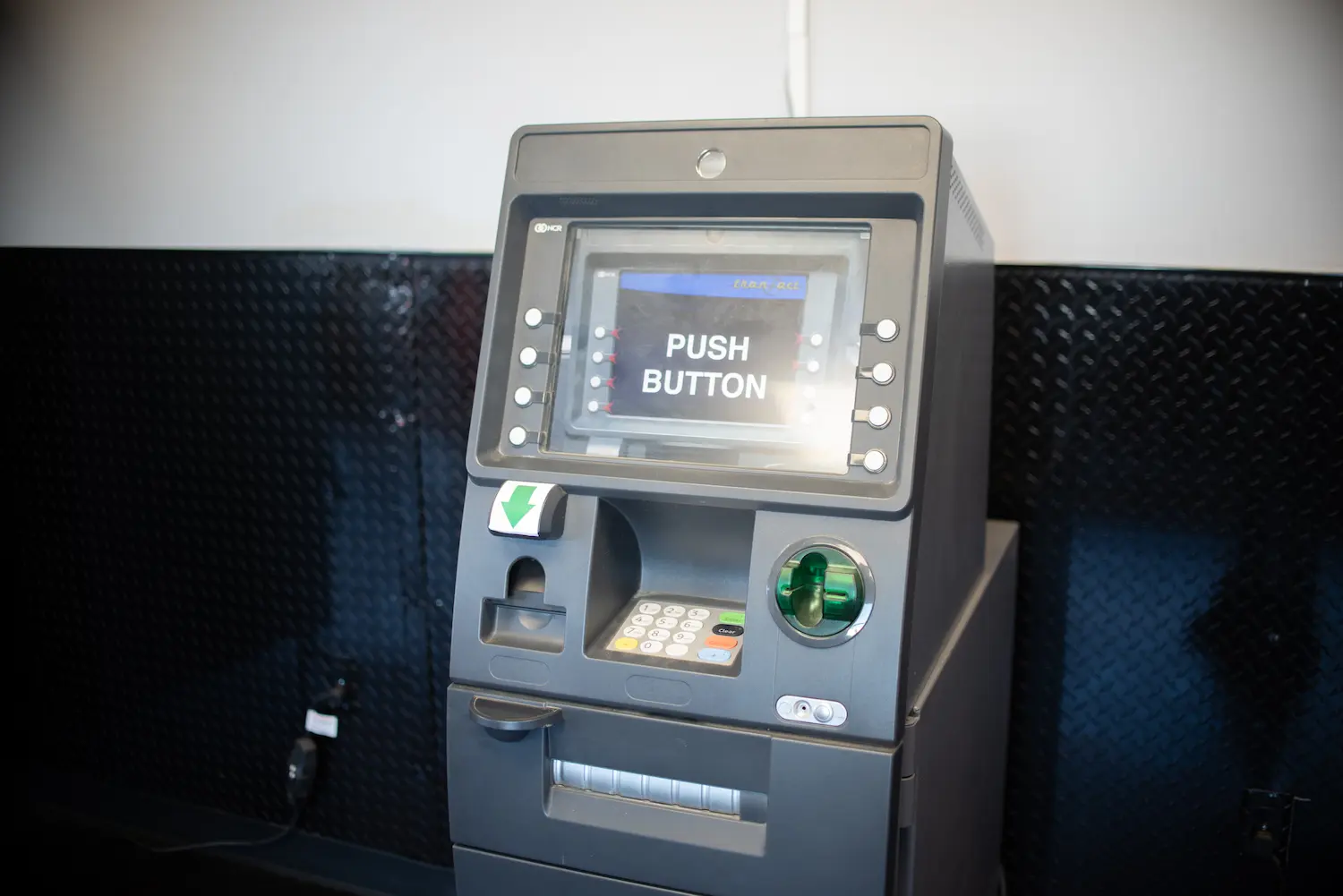 ATM Machine displaying message reading Push Button